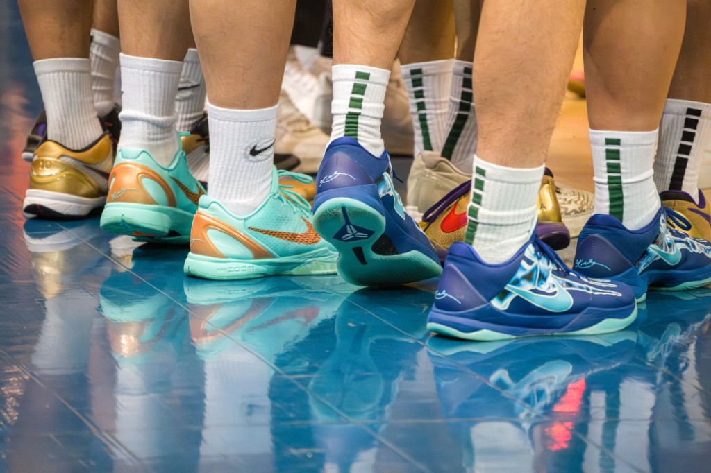Basketball sneakers in a huddle on a court